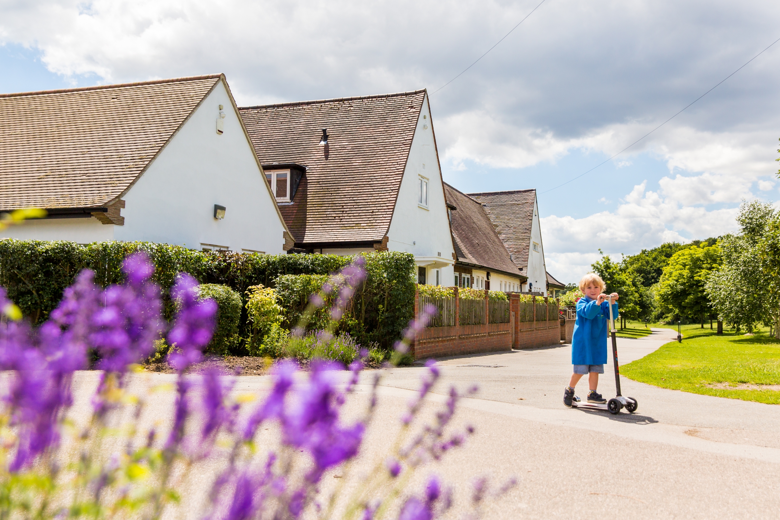 Child exploring nursery with parent nearby